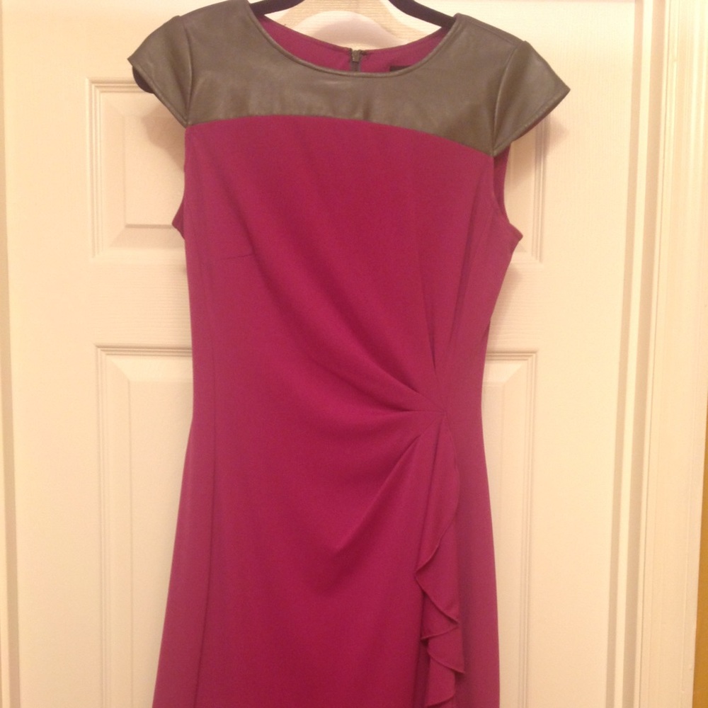 Beautiful dress with vegan leather accent.